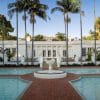 The image of the Scarface mansion while in front of a fountain.